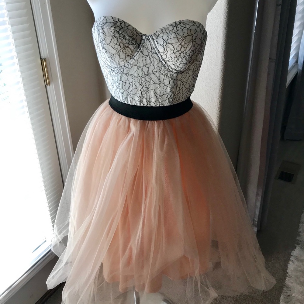 Strapless bandeau top with mesh skirt dress.